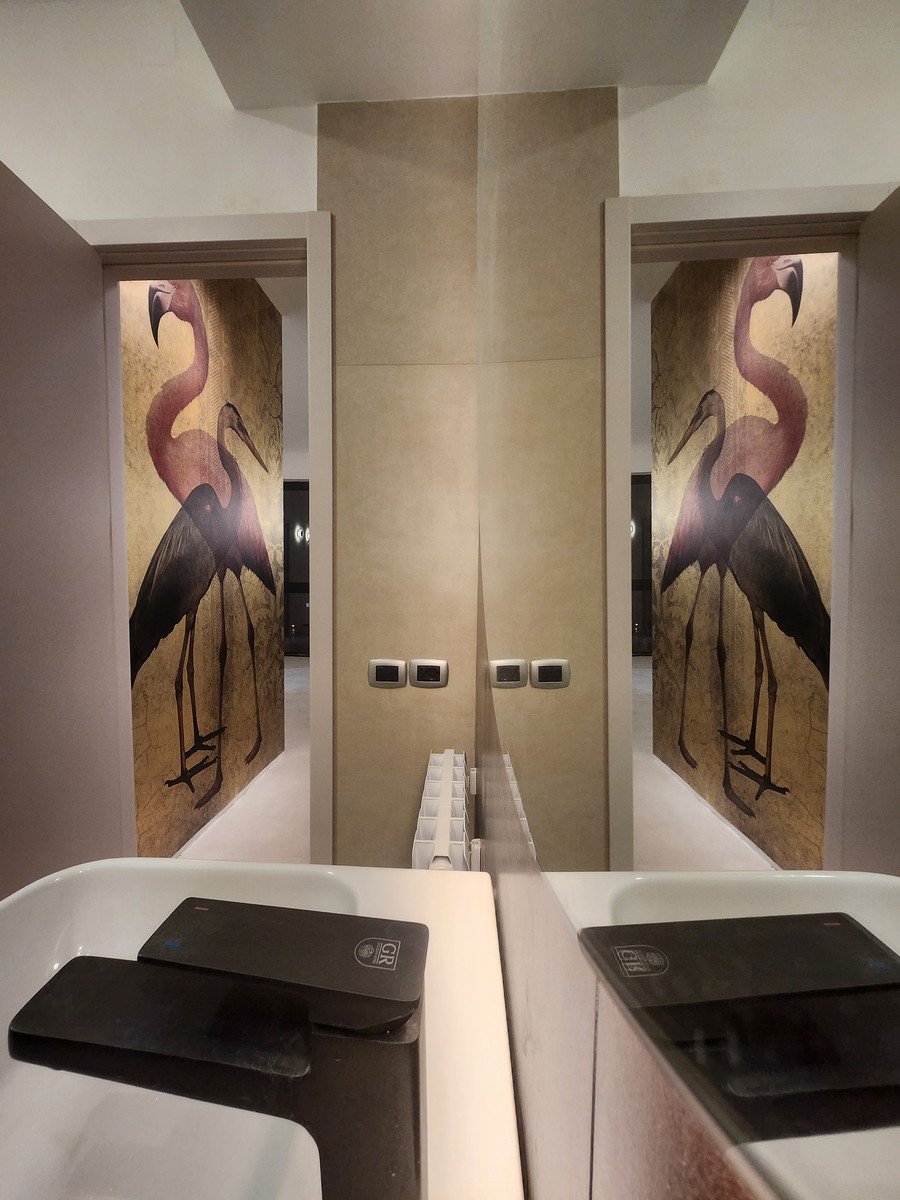 Luxury apartment exterior view in Saburtalo district, Tbilisi, showing modern architecture with large windows and balcony